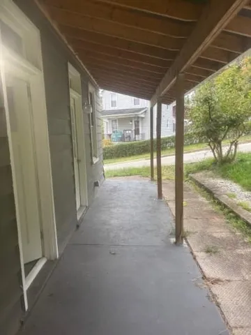 a view of porch with green space