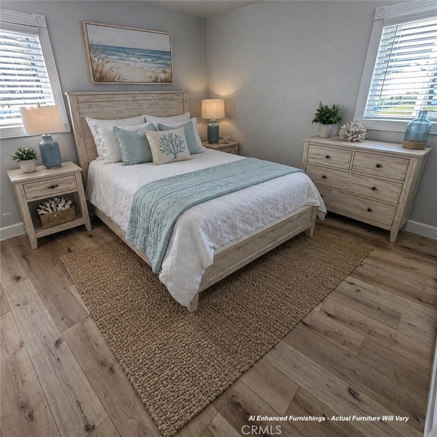 34112 Selva Road, Unit 336 Dana Point, CA 92629 - Photo 15 of 18 a bedroom with a bed a lamp and a window