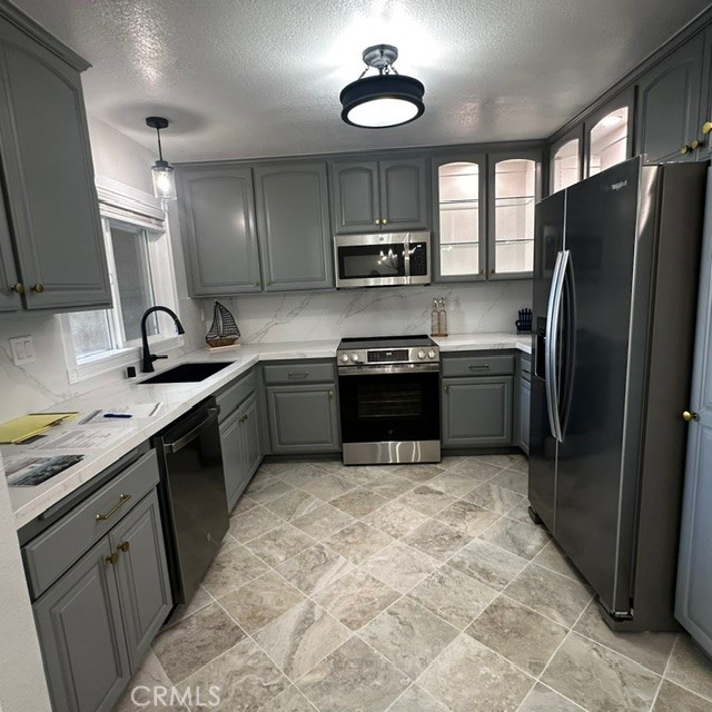 34112 Selva Road, Unit 336 Dana Point, CA 92629 - Photo 8 of 18 a kitchen with stainless steel appliances granite countertop a sink stove and refrigerator