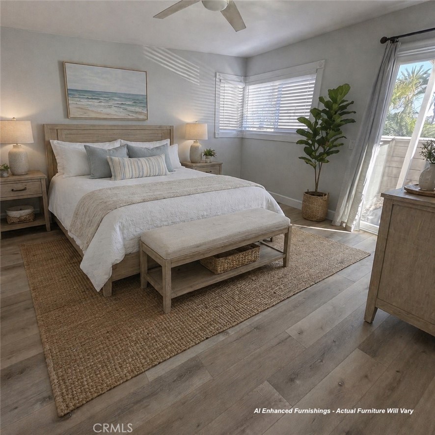 34112 Selva Road, Unit 336 Dana Point, CA 92629 - Photo 9 of 18 a bedroom with a large bed and a potted plant