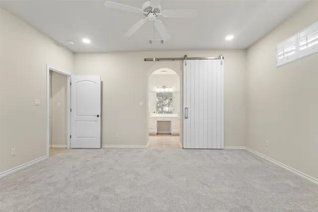 a view of a balcony and floor to ceiling window