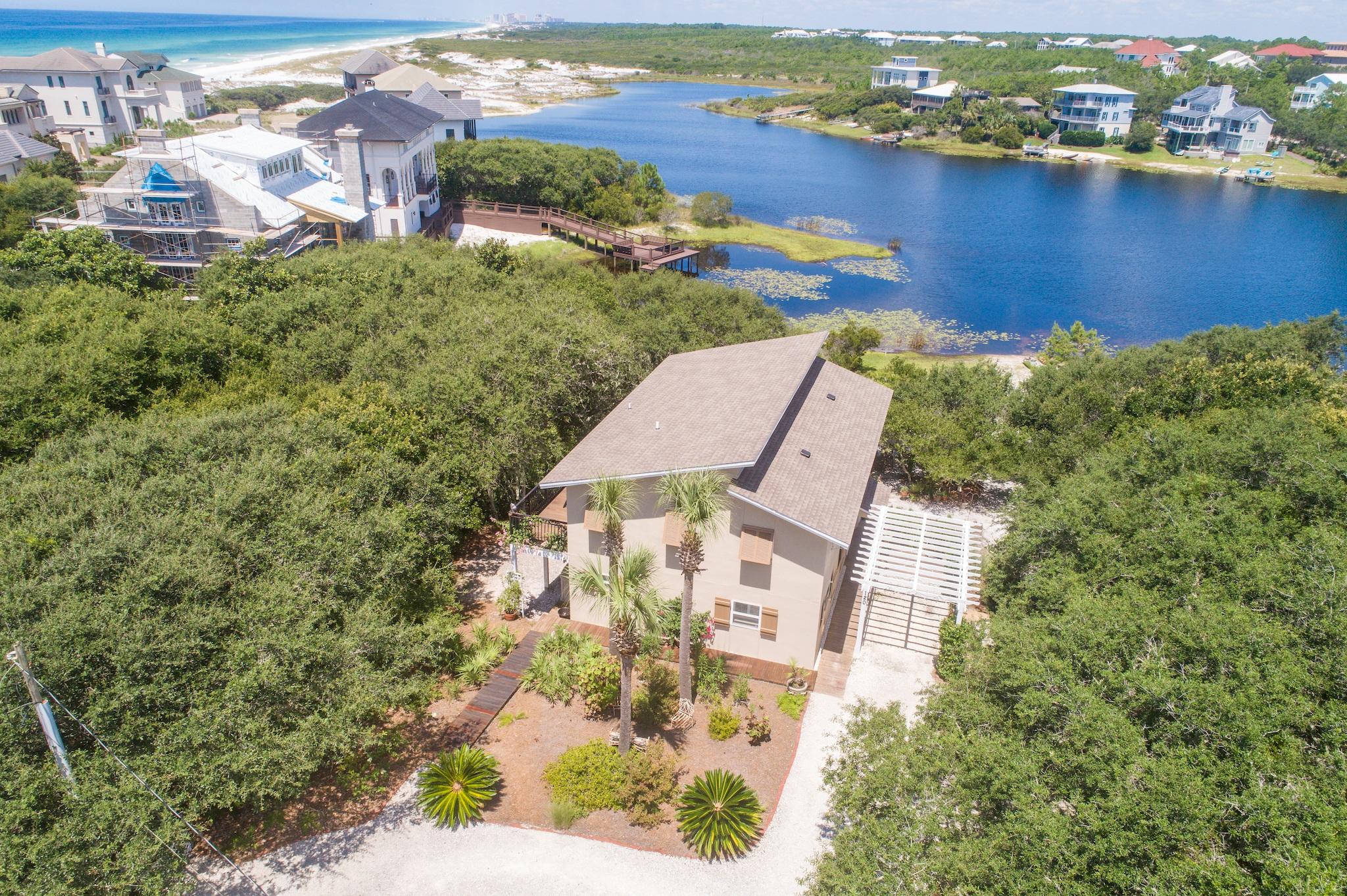 120 South Bishop Road Santa Rosa Beach, FL 32459 - Photo 60 of 64 an aerial view of a house with a lake view