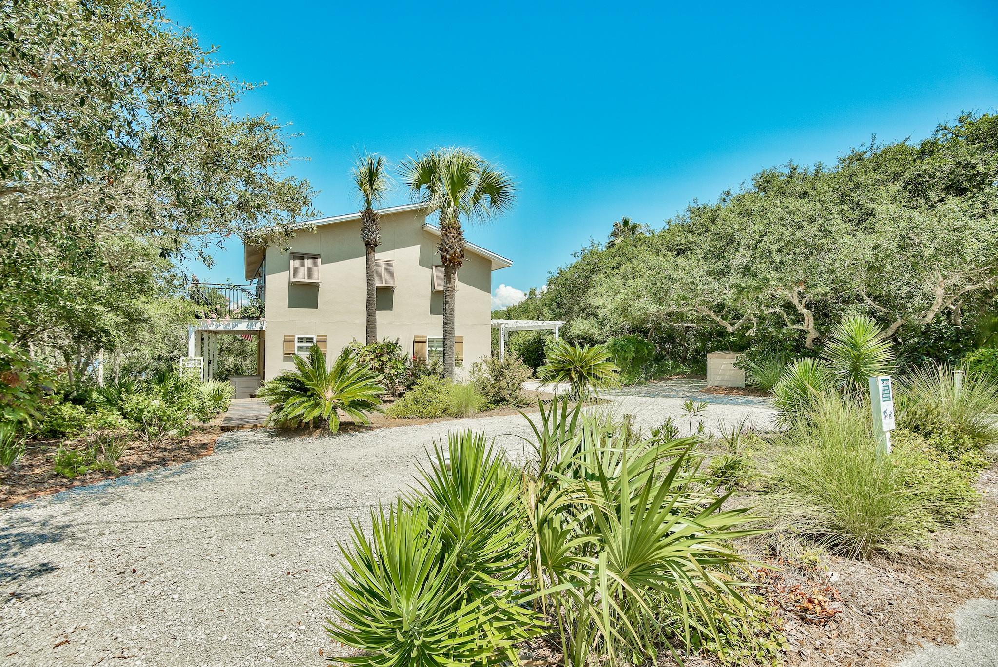 120 South Bishop Road Santa Rosa Beach, FL 32459 - Photo 8 of 64 a front view of a house with a yard