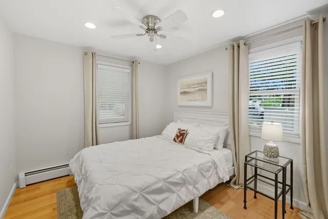 a living room with furniture and a glass window