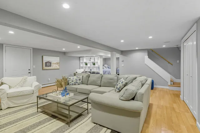 a bedroom with double bed and a wooden floor