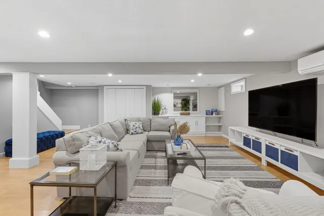 a sink with a cabinet and a rug