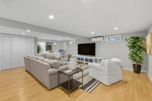 a view of house with deck and outdoor seating