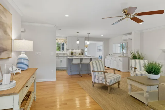 a living room with furniture fireplace and window
