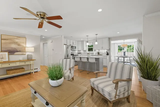 a kitchen with stainless steel appliances kitchen island granite countertop sink and cabinets