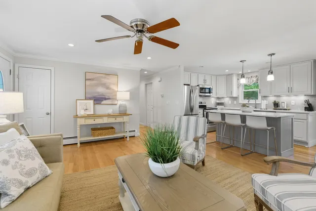 a kitchen with granite countertop a sink a counter top space stainless steel appliances and cabinets