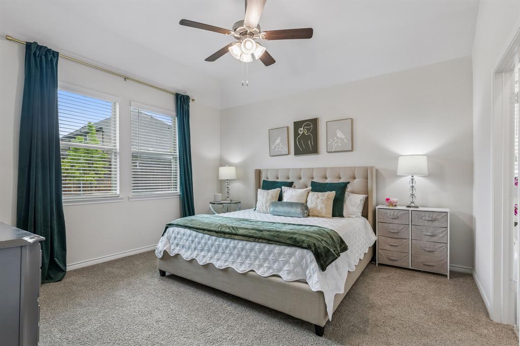 10313 Geode Street Aubrey, TX 76227 - Photo 4 of 13 Bedroom featuring a vaulted ceiling and a ceiling fan with light fixture