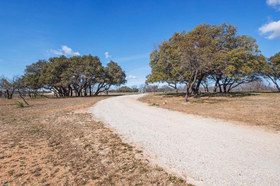 4319 County Road 337 Early, TX 76802 - Photo 24 of 31 a view of empty space with trees in the background