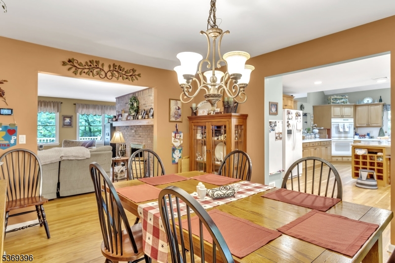 18 Hickory Run Road Califon, NJ 07830 - Photo 13 of 32 a view of a dining room with furniture a chandelier and wooden floor