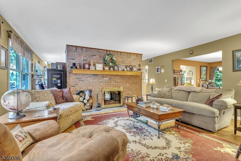 18 Hickory Run Road Califon, NJ 07830 - Photo 14 of 32 a living room with furniture a fireplace and a large window