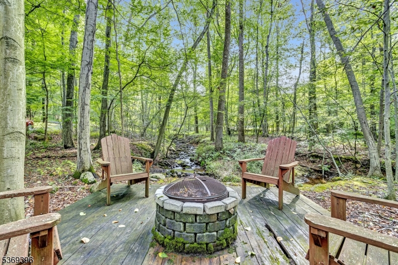 18 Hickory Run Road Califon, NJ 07830 - Photo 26 of 32 a view of a patio with table and chairs potted plants and large tree