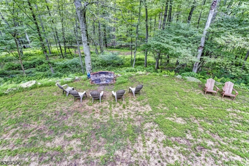 18 Hickory Run Road Califon, NJ 07830 - Photo 28 of 32 a backyard of a house with table and chairs