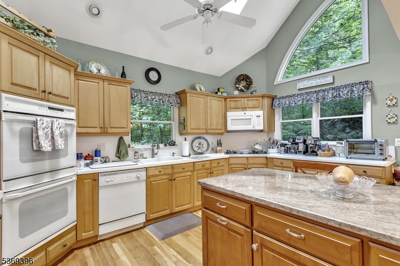 18 Hickory Run Road Califon, NJ 07830 - Photo 9 of 32 a view of a kitchen counter space a sink a window and stainless steel appliances