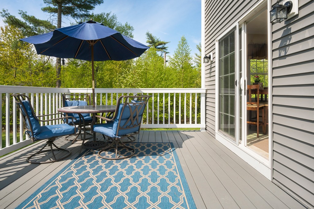 27 Michael Drive Rutland, MA 01543 - Photo 29 of 30 a view of balcony with furniture and umbrella