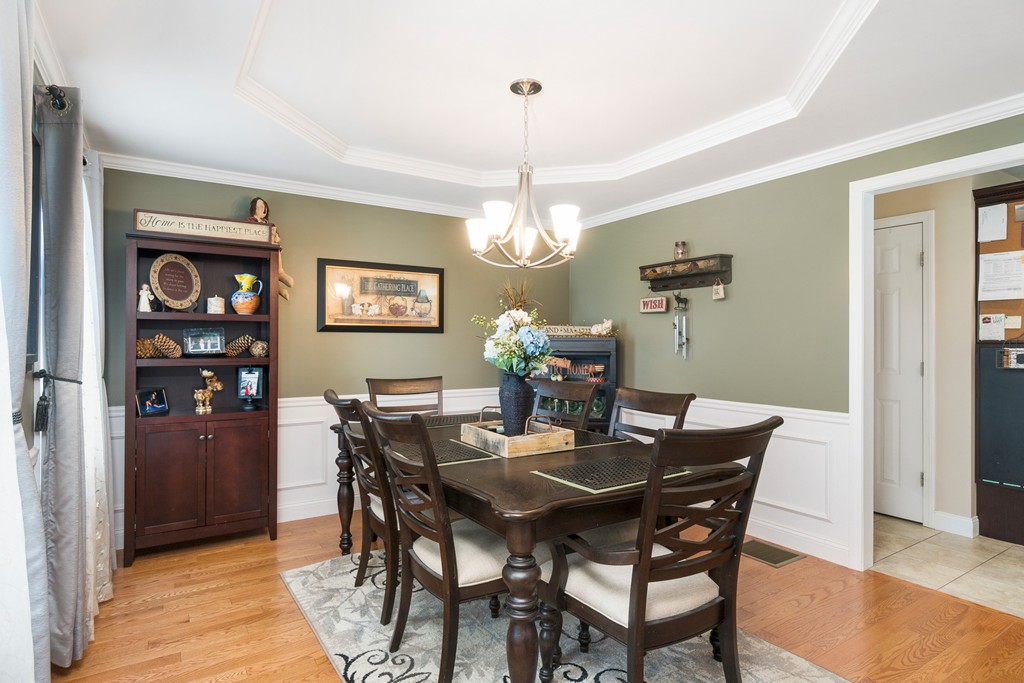 27 Michael Drive Rutland, MA 01543 - Photo 9 of 30 a dining room with furniture a chandelier and wooden floor