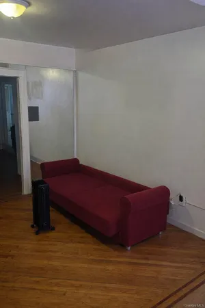 a white toilet sitting next to a bath tub