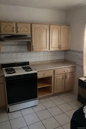 a kitchen with a stove and a sink