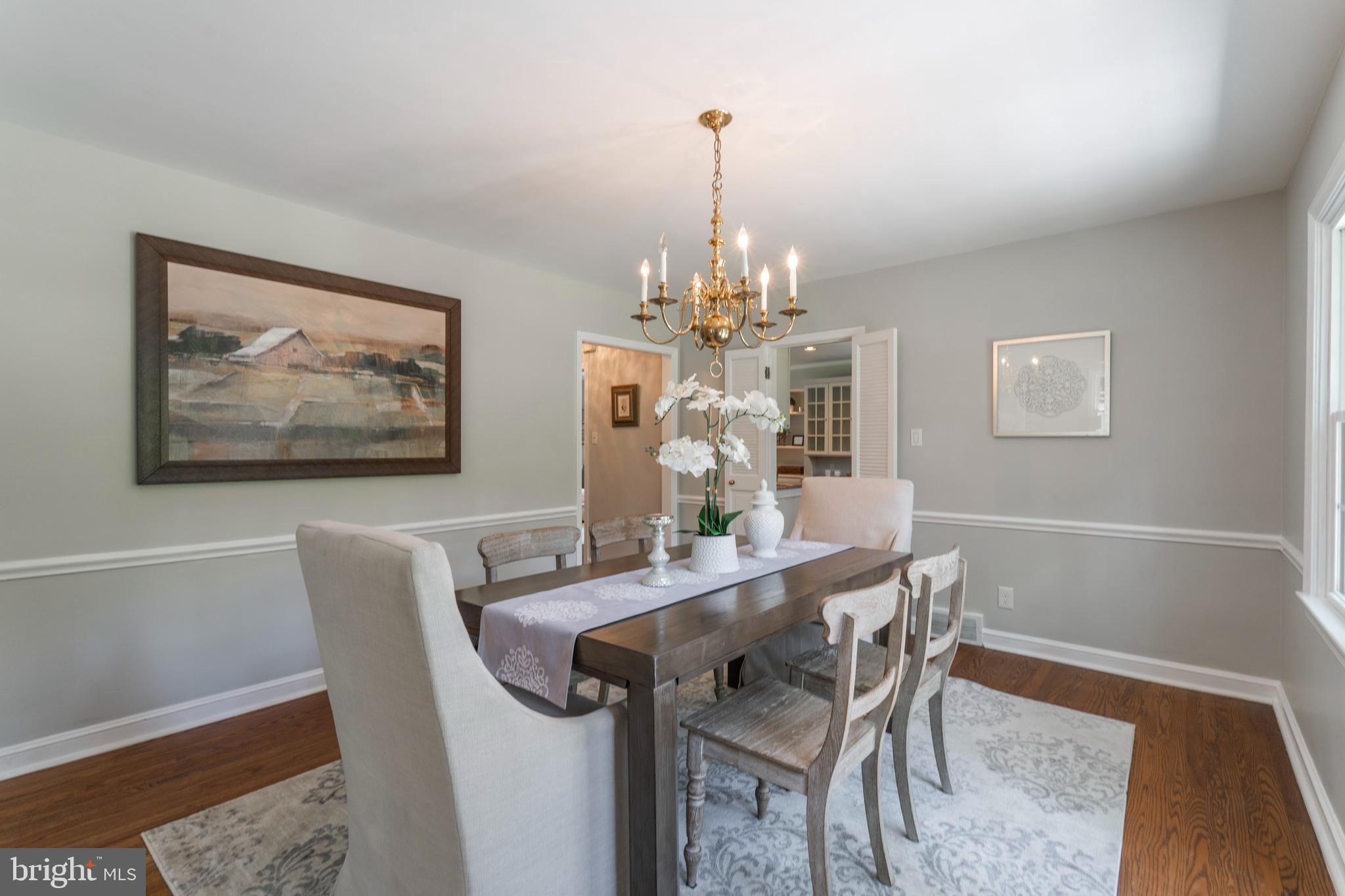 735 Woodcrest Road Wayne, PA 19087 - Photo 14 of 50 a view of a dining room with furniture and chandelier