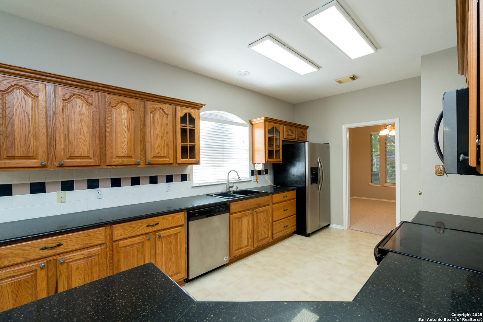 244 Turkey Tree Cibolo, TX 78108 - Photo 13 of 48 a large kitchen with stainless steel appliances granite countertop a lot of counter space and a sink