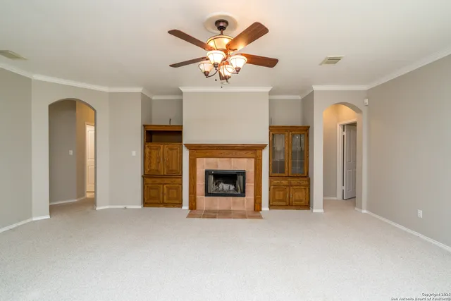 a view of an empty room with a fireplace
