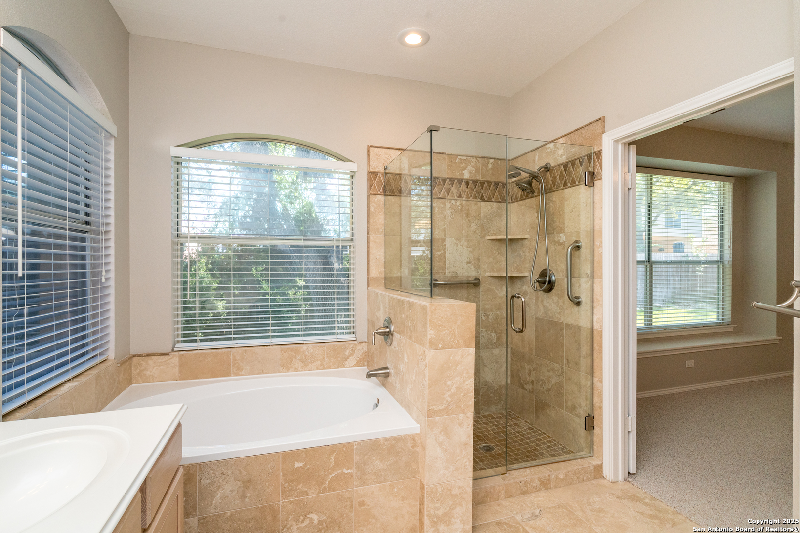 244 Turkey Tree Cibolo, TX 78108 - Photo 23 of 48 a bathroom with a bathtub and a shower