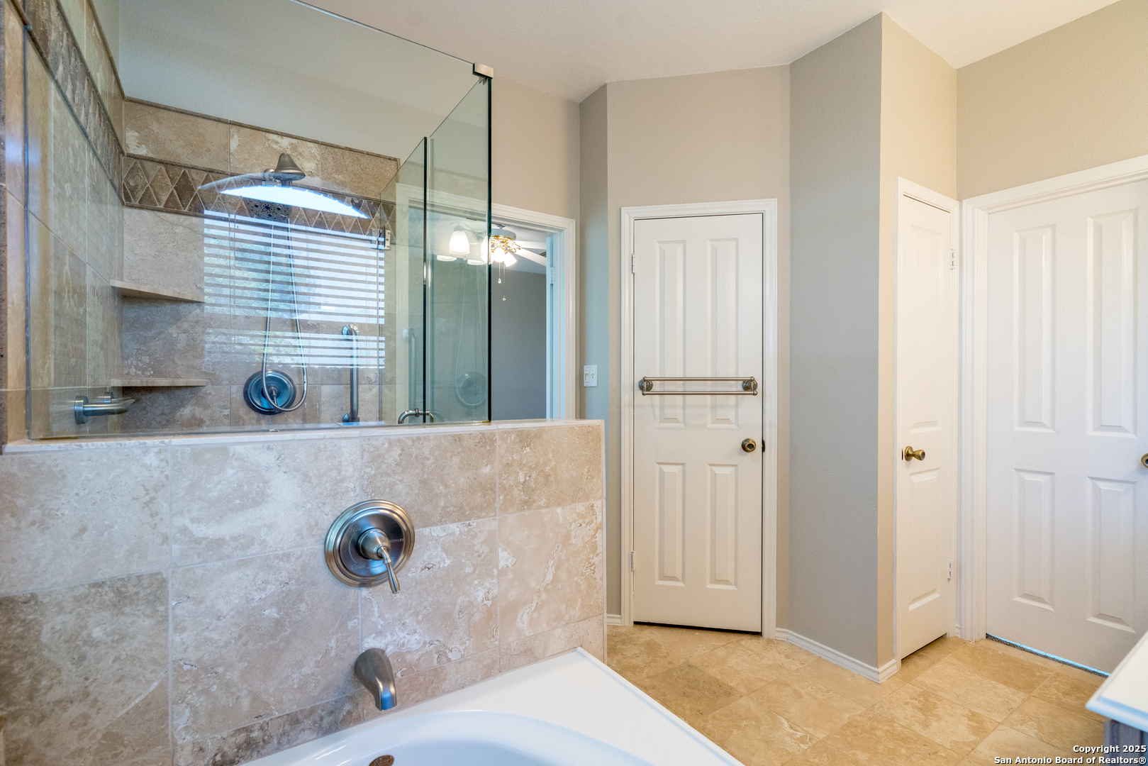244 Turkey Tree Cibolo, TX 78108 - Photo 26 of 48 a bathroom with a tub shower and window