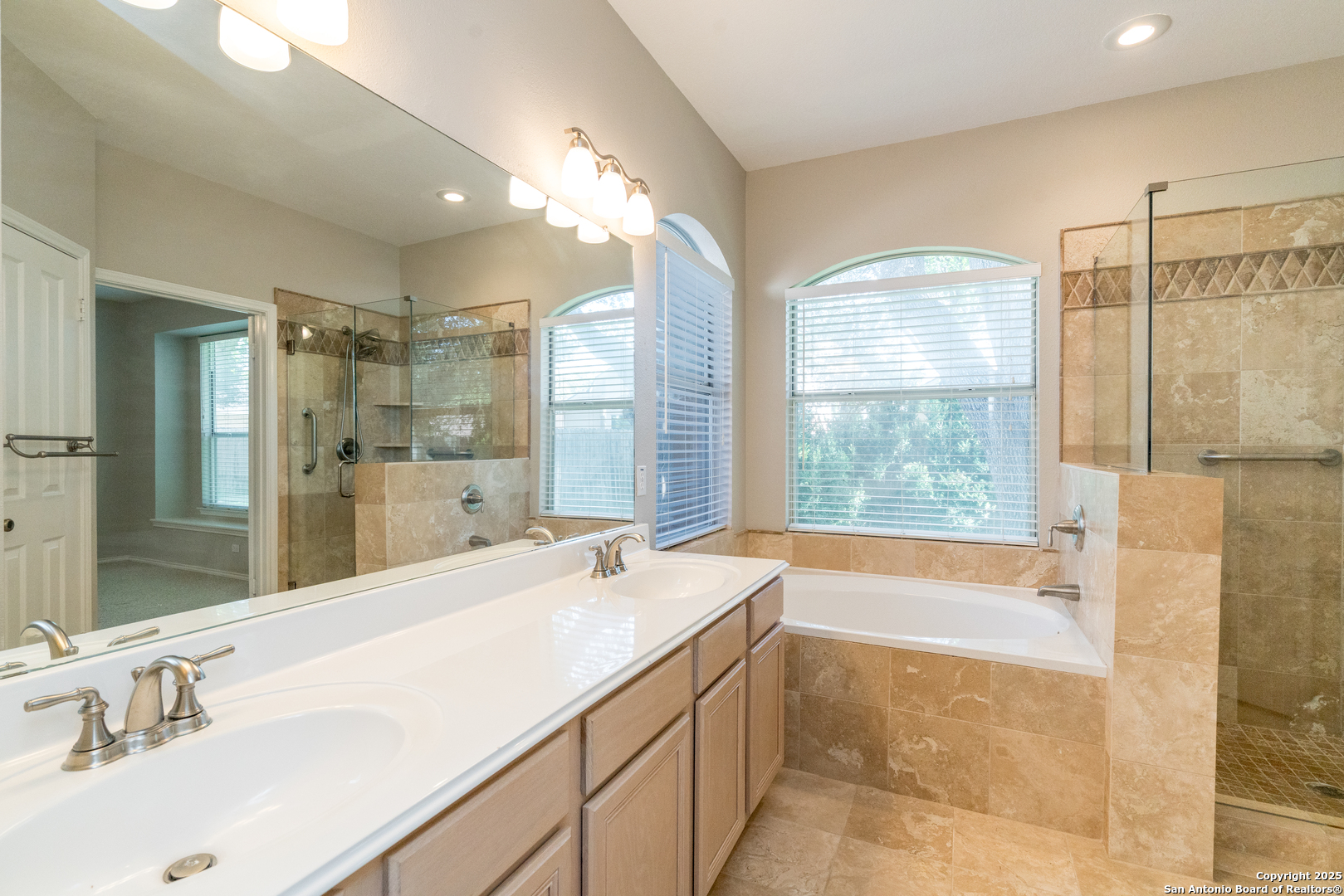 244 Turkey Tree Cibolo, TX 78108 - Photo 29 of 48 a bathroom with a tub sink and mirror