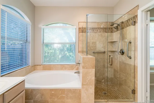 a bathroom with a bathtub and shower