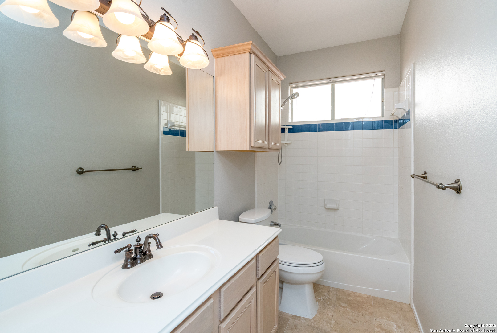 244 Turkey Tree Cibolo, TX 78108 - Photo 33 of 48 a bathroom with a toilet a sink a mirror and a shower