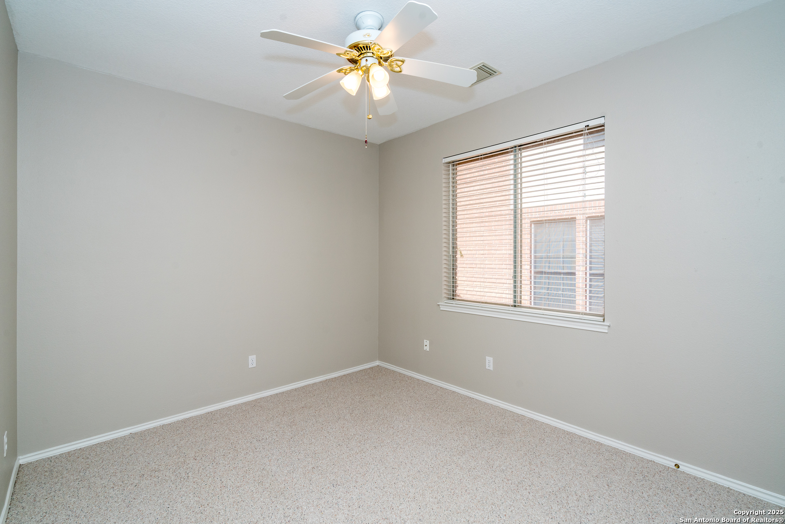 244 Turkey Tree Cibolo, TX 78108 - Photo 34 of 48 an empty room with a window and a fan