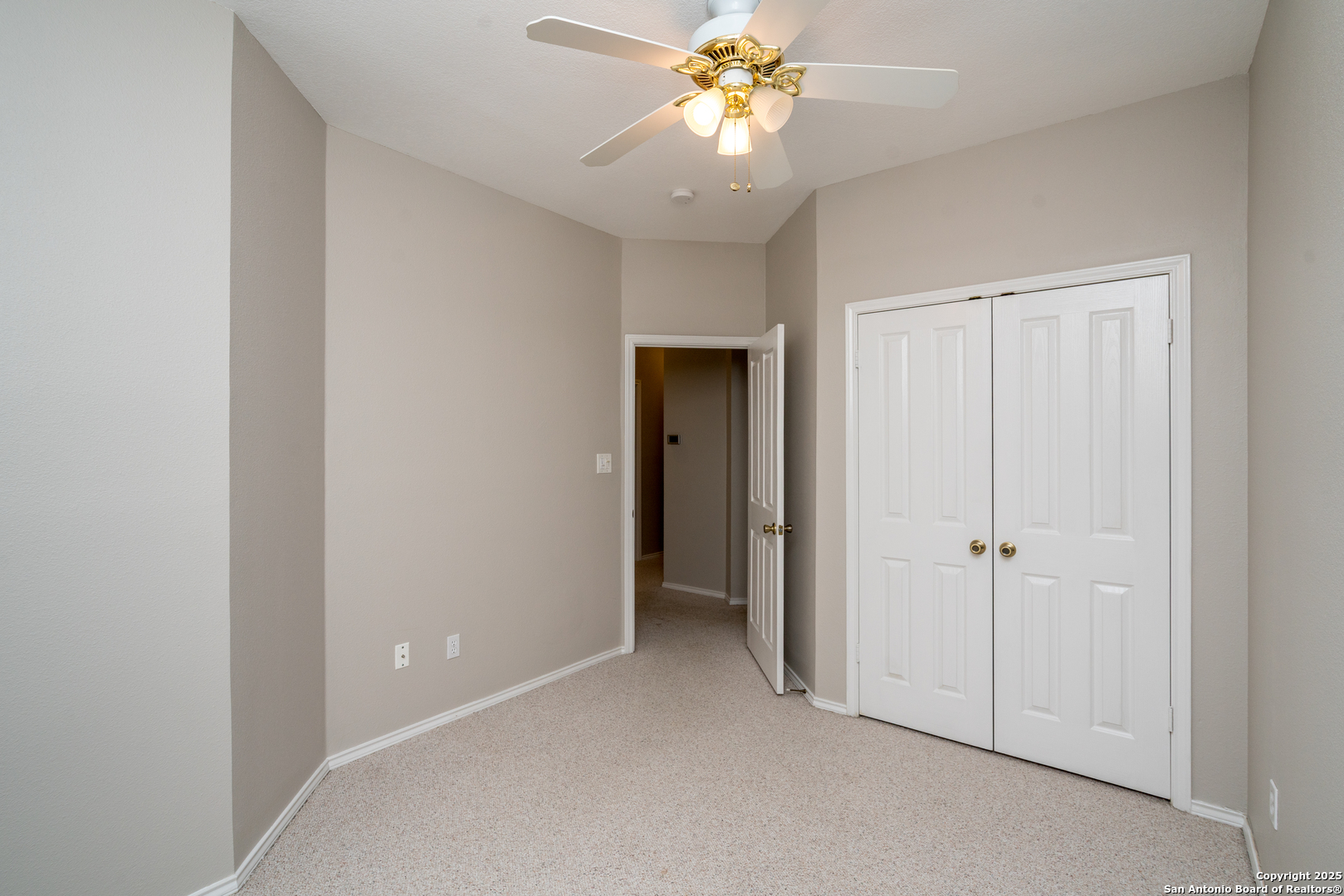 244 Turkey Tree Cibolo, TX 78108 - Photo 38 of 48 an empty room with a chandelier fan and closet