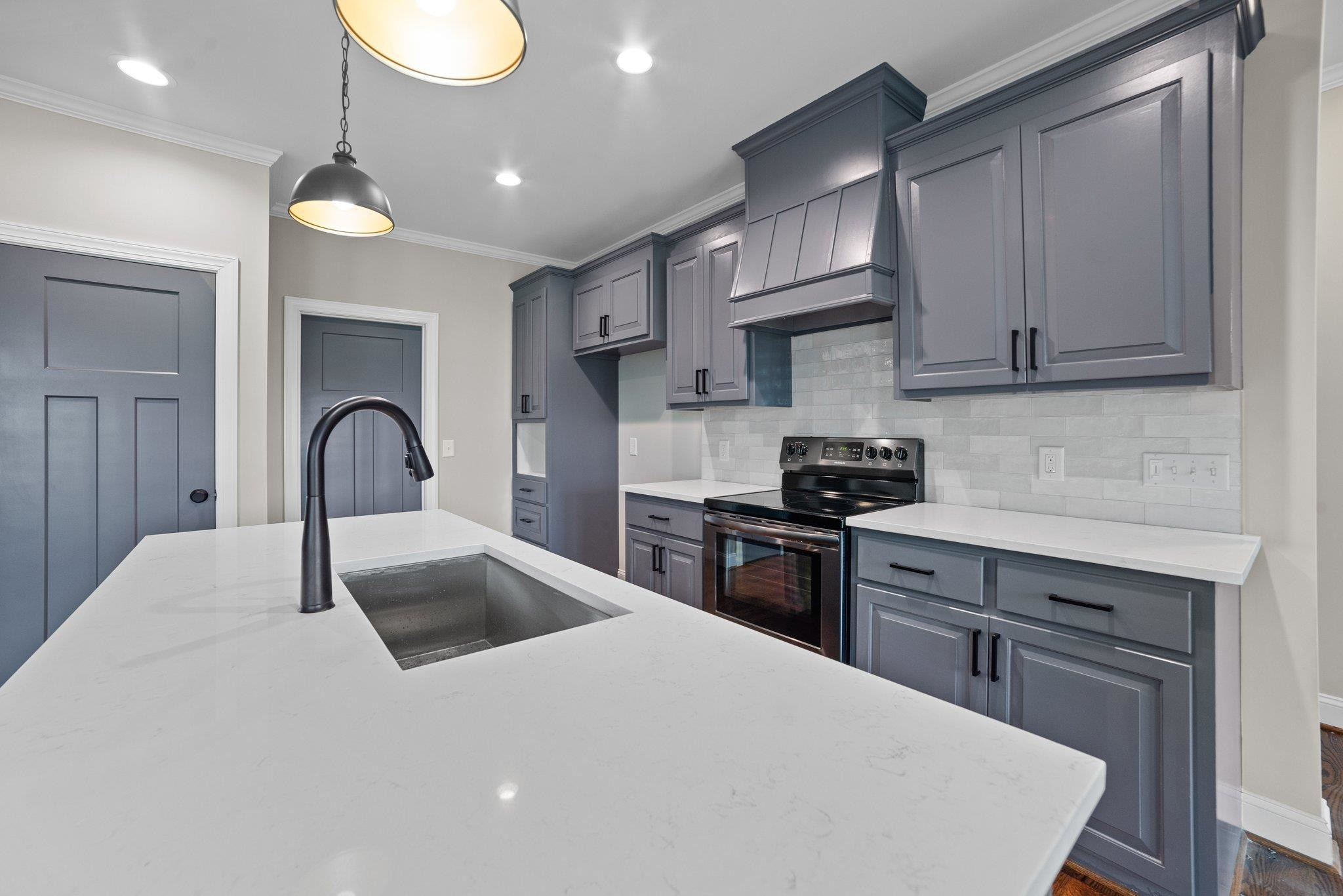 5726 Harvest Rdg Road Battleboro, NC 27809 - Photo 6 of 32 a kitchen with granite countertop a stove a sink a refrigerator and cabinets