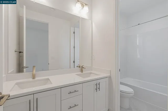 a bathroom with a sink and a large mirror