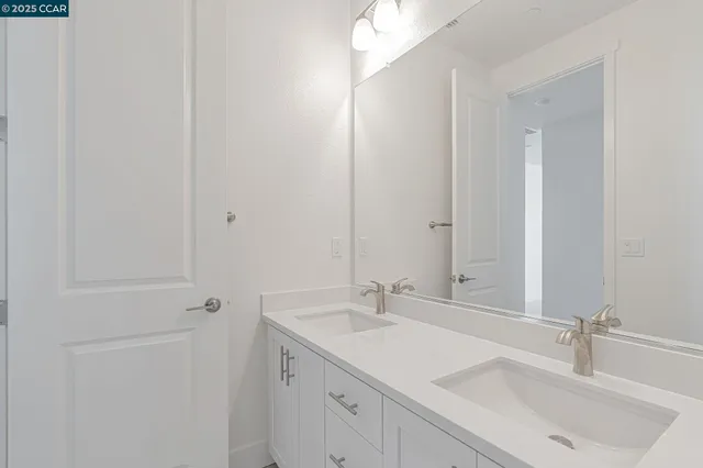 a bathroom with a sink and mirror