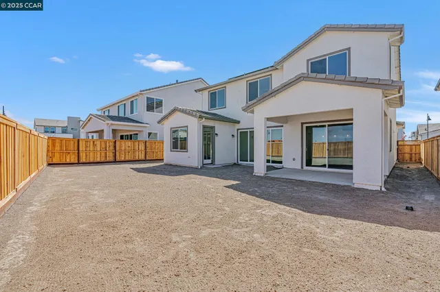 a view of a house with a yard and garage