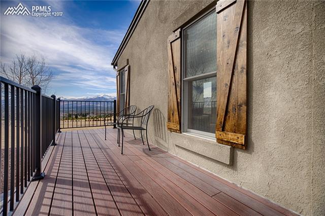 14570 Sterling Road Colorado Springs, CO 80921 - Photo 2 of 3 Front Porch view with brand new stucco and distressed shutters.
