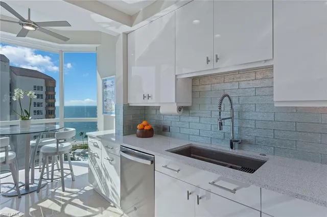 a kitchen with a sink and cabinets