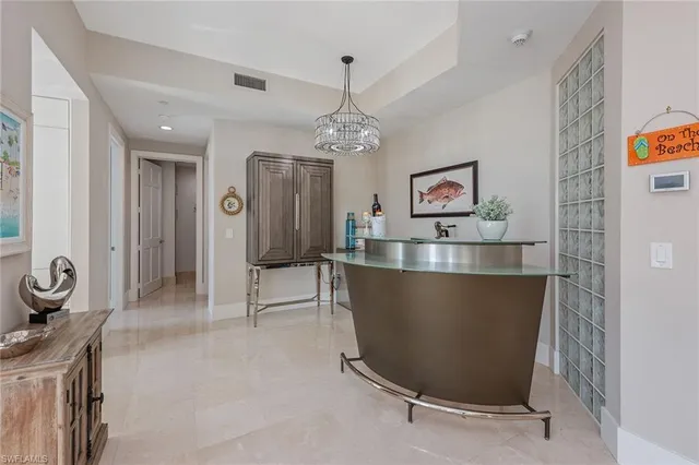 a view of a hallway with dining area