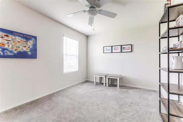 a view of a livingroom with furniture and a window