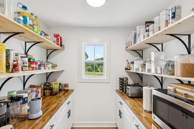 a kitchen with stainless steel appliances granite countertop a sink and a stove