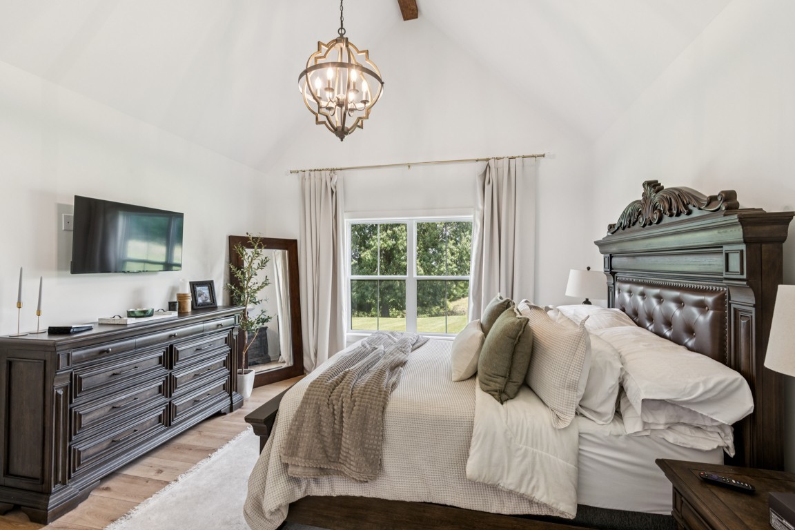 2590 Oakdale Road Westmoreland, TN 37186 - Photo 17 of 25 a bedroom with a bed and a flat screen tv