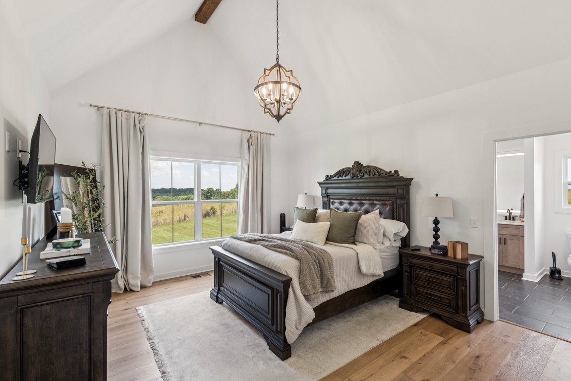 2590 Oakdale Road Westmoreland, TN 37186 - Photo 18 of 25 a living room with a bed furniture and a flat tv screen