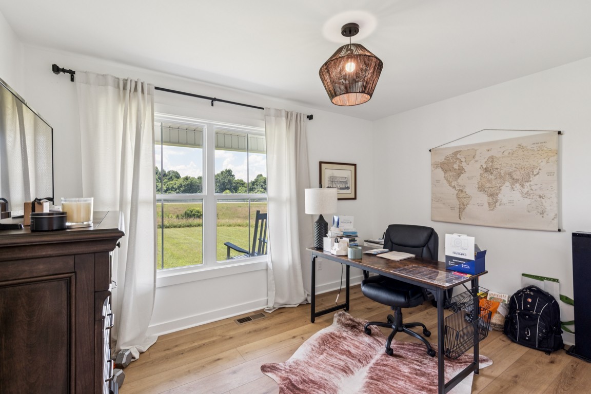 2590 Oakdale Road Westmoreland, TN 37186 - Photo 22 of 25 a view of a workspace with furniture and a window