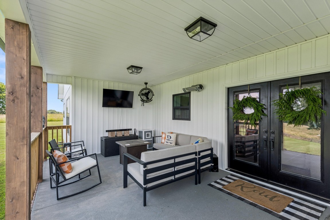 2590 Oakdale Road Westmoreland, TN 37186 - Photo 4 of 25 a living room with furniture and a flat screen tv