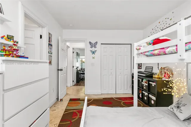 a very nice looking room with a baby bed