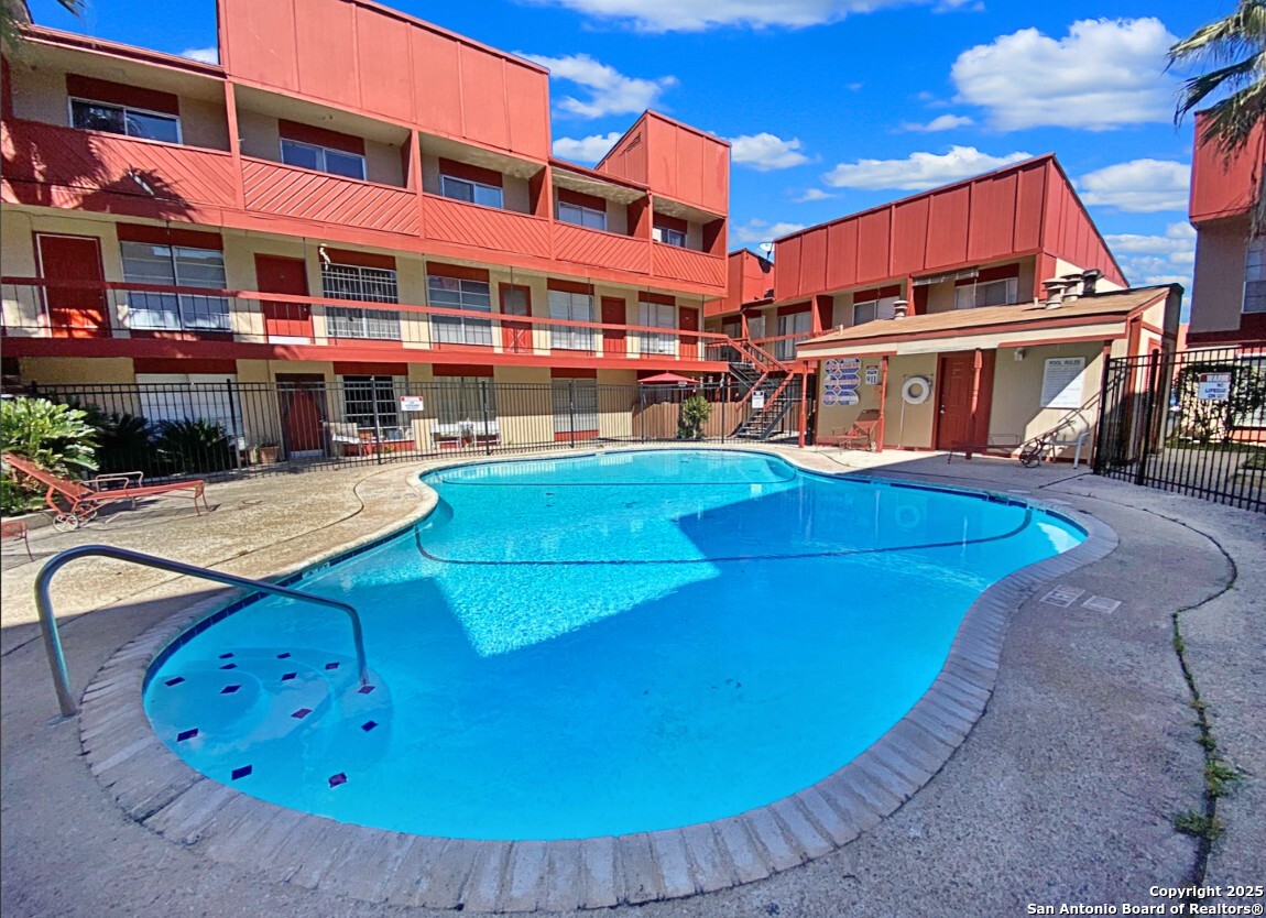 a view of a building with swimming pool